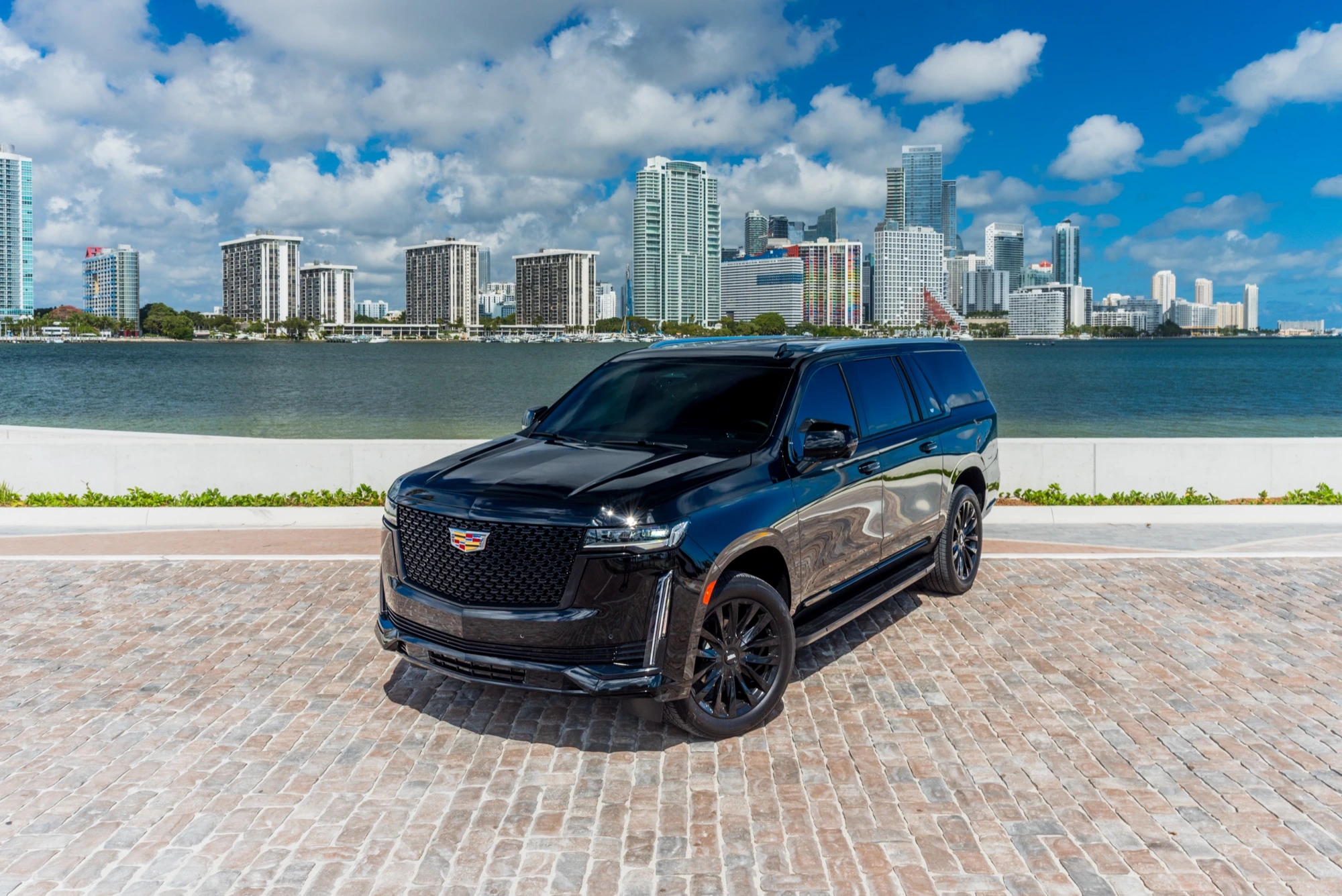 Blacked-out Cadillac Escalade overlooking the Miami skyline